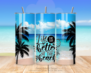 Three-side view of tumbler with lid and straw featuring Life Is Better on the Beach quote and palm, sand, ocean design.
